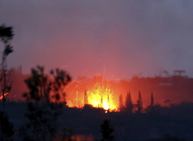 Lava shoots into the night sky from active fissures on the lower east rift of the Kilauea volcano, near Pahoa, Hawaii.