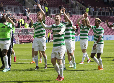 Callum McGregor (centre) celebrates with team-mates after the Ladbrokes Scottish Premiership match at Tynecastle.