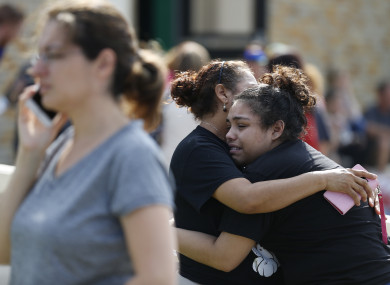 Santa Fe High School junior Guadalupe Sanchez, 16, cries in the arms of her mother, Elida Sanchez, after reuniting with her at a meeting point at a nearby Alamo Gym fitness centre following a shooting at Santa Fe High School in Santa Fe, Texas.