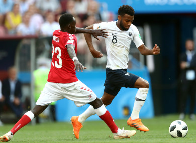Denmark's Pione Sisto (left) and France midfielder Thomas Lemar.
