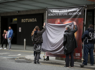 Banners belonging to the Irish Centre for Bio-Ethical Reform (ICBR) being blocked by pro-choice activists outside the Rotunda Hospital in Dublin.