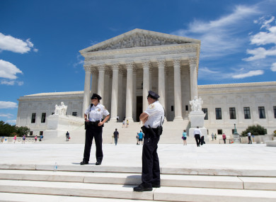 US Supreme Court police officers stand outside the Supreme Court in Washington DC