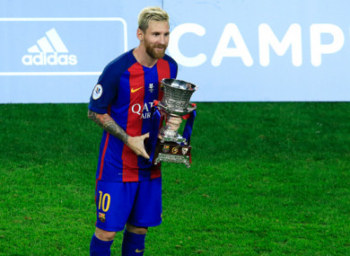 Lionel Messi holds the Supercopa de España in 2016.