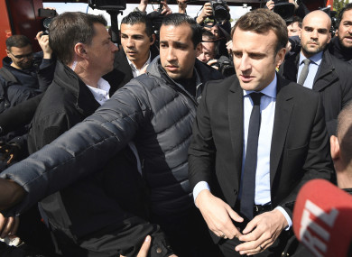 French centrist presidential election candidate Emmanuel Macron, flanked by his bodyguard, Alexandre Benalla.
