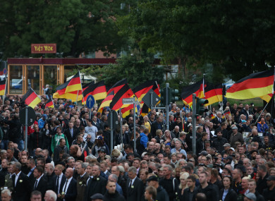 Protesters attending demonstration in Chemnitz, eastern Germany, yesterday