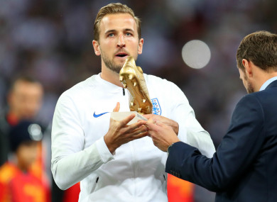 Harry Kane collects the World Cup Golden Boot from Gareth Southgate.