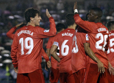 Real Madrid's Alvaro Odriozola, left, celebrates with his teammate Vinicius Junior after scoring.