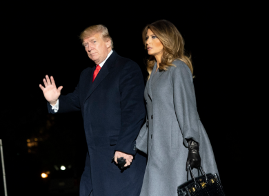 US President Donald Trump and First Lady Melania Trump arrive back at the White House yesterday.