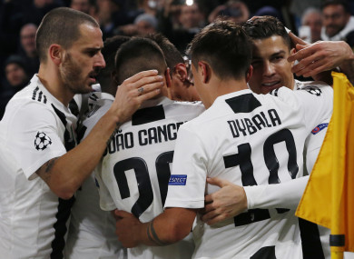 Juventus players celebrate after scoring against Valencia.