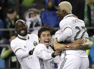 Portland Timbers players celebrate after their shoot-out victory over Seattle Sounders.