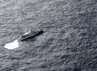 Japan's Coast Guard ship is seen at sea during a search operation for US Marine refueling plane and fighter jet off Muroto, Kochi prefecture, southwestern Japan