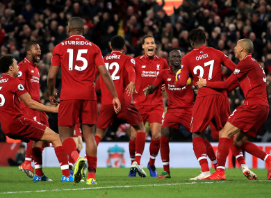 Liverpool players celebrate after Divock Origi's late winner on Sunday.