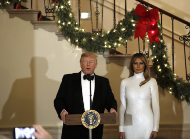 Donald J. Trump speaks as First lady Melania Trump looks on at the Congressional Ball at White House, 15 December 15.