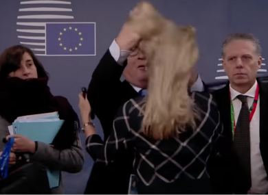 Juncker ruffling a woman's hair at a recent EU Summit.
