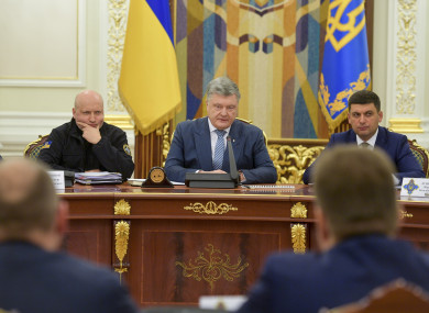 Ukrainian President Petro Poroshenko, centre,i n Kiev, Ukraine, today.