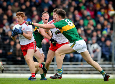 Kerry's Jack Barry tackling Pete Harte of Tyrone on Sunday.