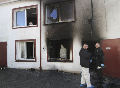 Forensic and other police experts examine the site of a fire in an Escape Room, in Koszalin, northern Poland, yesterday.