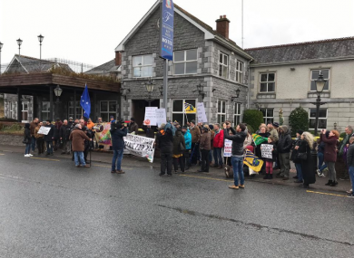 Around 100 people attended a rally in support of refugees outside the Shannon Key West Hotel