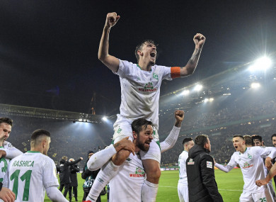 Bremen's Max Kruse, top, celebrates on the shoulders of goalscorer Martin Harnik.