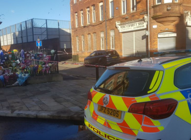 Floral tributes left near at the scene in east Belfast where Ian Ogle was murdered on Sunday night.