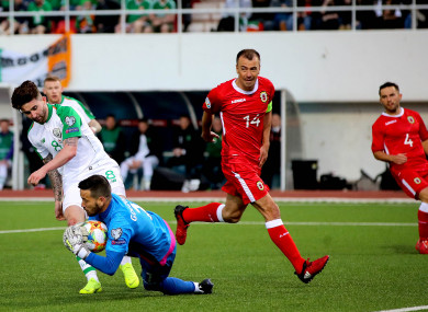 Sean Maguire clashes with Gibraltar 'keeper Kyle Goldwin.