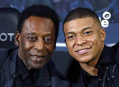 Pele and Mbappe pictured together during a photocall in Paris.