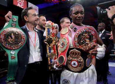 Claressa Shields holds her belts after defeating Christina Hammer by unanimous decision.