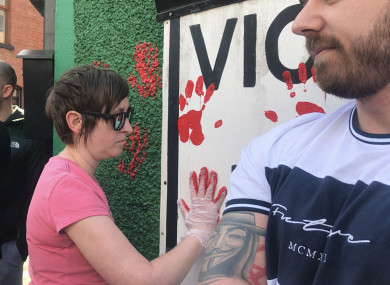 Friends of murdered journalist Lyra McKee defaced the walls of a dissident republican office in Derry with red paint.