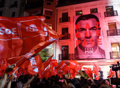Supporters of the Spanish Socialist Party (PSOE) celebrate victory at its headquarters in Madrid.