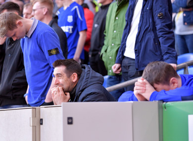Cardiff City fans appear dejected.