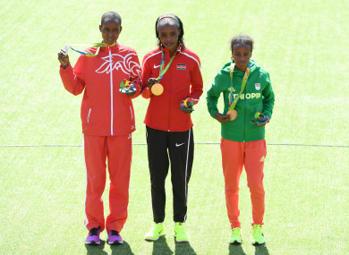 Eunice Jepkirui Kirwa (left) with her silver medal after the marathon at the Rio 2016 Olympic Games.