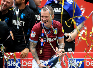 Whelan celebrates Aston Villa's promotion win against Derby County.