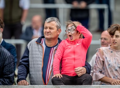 A young racegoer reacts as she watches the feature race of the day at the Curragh last Sunday.