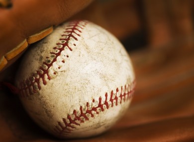 Close-up of a baseball in a glove.