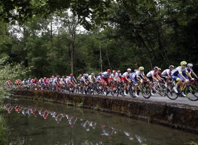 The pack rides during the 14th stage of the Tour de France over the Tourmalet pass.