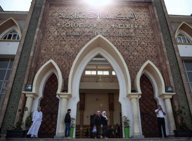 People stand outside the Moroccan court during the trial of the men accused of killing two Scandinavian tourists.