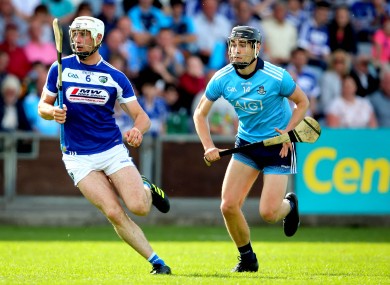 Dublin's Ronan Hayes chases down Ryan Mullaney of Laois.