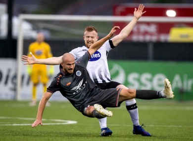 Dundalk's Sean Hoare with Roman Debelko of Riga FC.