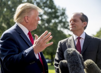 President Donald Trump alongside his departing Labor Secretary Alex Acosta.