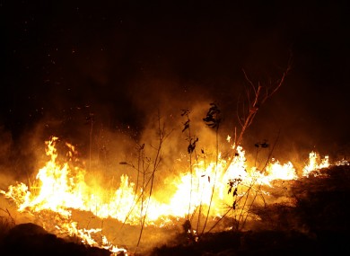 A fire burns on the margins of the city of Porto Velho.