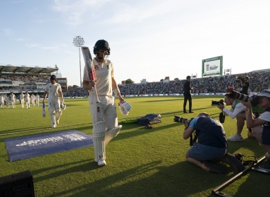 Root walks off after an unbeaten half-century.