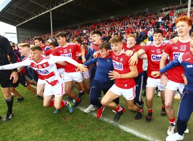 Cork players react to the final whistle at O'Moore Park.