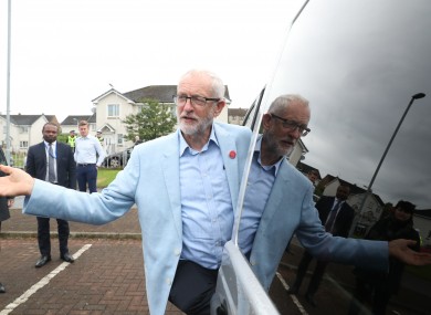 Labour leader Jeremy Corbyn gestures as he leaves after viewing the fire damaged Woodmill High School during a visit to Dunfermline, on the first day of a three day tour of Scottish constituencies.