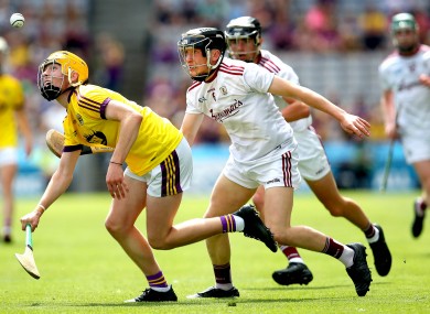 Ian McGlynn tackles Wexford's Luke Kavanagh in the All-Ireland minor hurling semi-final.