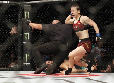 Zhang Weili (blue gloves) defeats Jessica Andrade (red gloves) during UFC Fight Night at Shenzhen Universiade Sports Centre.