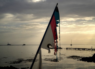 A surf sail shattered by the wind is seen in a private harbor while several ships leave the harbor to protect themselves from the arrival of Hurricane Dorian In Boqueron, Puerto Rico.
