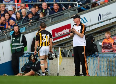 Richie Hogan walks past Brian Cody after being red carded.