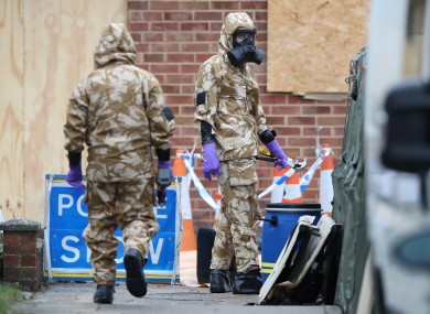 Members of the military wear protective clothing as work continues on the home of former Russian spy Sergei Skripal in Salisbury, Wiltshire.