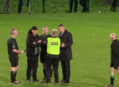 Ciaran McCavana calls a halt to a shoot-out after consulting both managers.