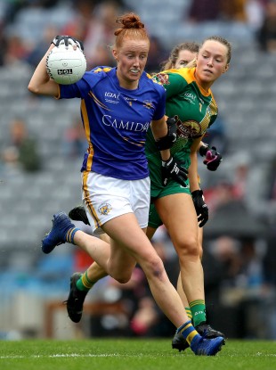 Aishling Moloney is tackled by Sarah Wall.